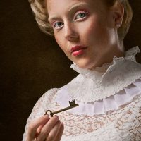woman holding skeleton key