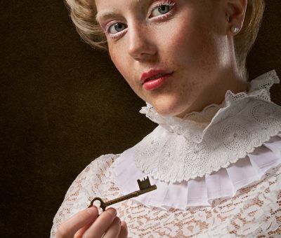 woman holding skeleton key
