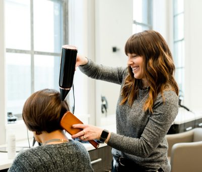 woman holding hair dryer